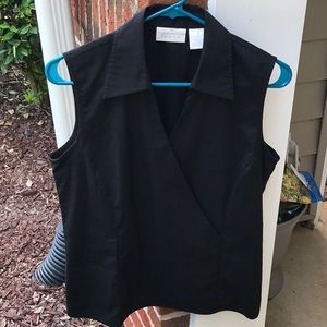 Be comfy and cool in this nice little sleeveless , criss cross black top!